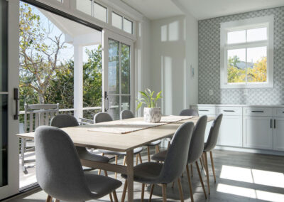 Dining room with open doors to deck